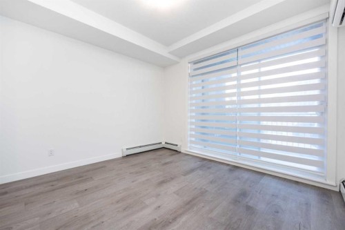 1105-200 Seton Circle Se, Calgary, AB - Indoor Photo Showing Other Room