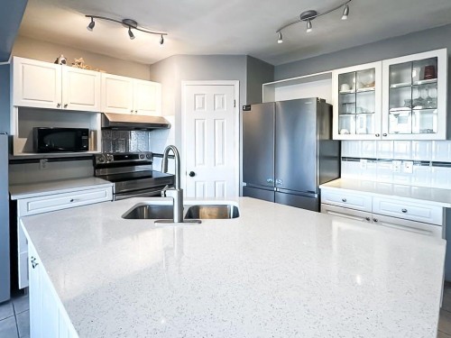 64 Macewan Park Rise Nw, Calgary, AB - Indoor Photo Showing Kitchen With Double Sink