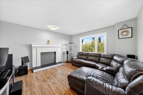 64 Macewan Park Rise Nw, Calgary, AB - Indoor Photo Showing Living Room With Fireplace