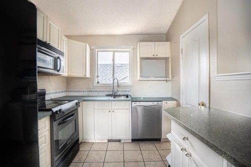 8051 Laguna Way Ne, Calgary, AB - Indoor Photo Showing Kitchen