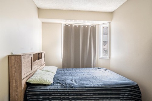 8051 Laguna Way Ne, Calgary, AB - Indoor Photo Showing Bedroom