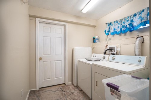 8051 Laguna Way Ne, Calgary, AB - Indoor Photo Showing Laundry Room