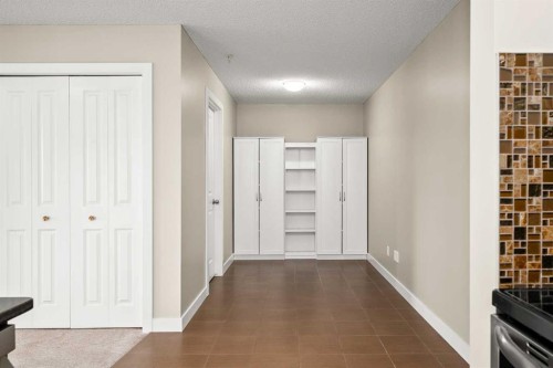 3309-403 Mackenzie Way Sw, Airdrie, AB - Indoor Photo Showing Other Room