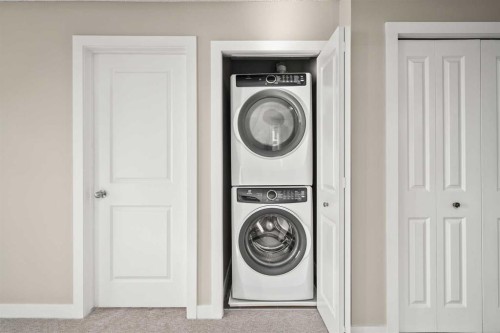 3309-403 Mackenzie Way Sw, Airdrie, AB - Indoor Photo Showing Laundry Room