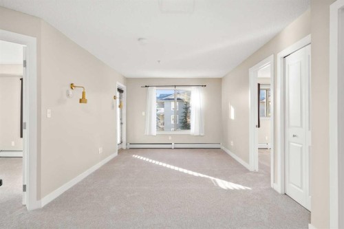 3309-403 Mackenzie Way Sw, Airdrie, AB - Indoor Photo Showing Other Room