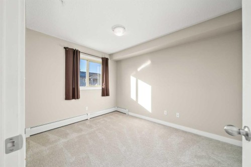 3309-403 Mackenzie Way Sw, Airdrie, AB - Indoor Photo Showing Other Room