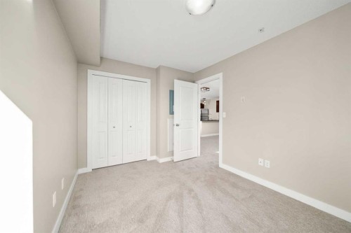 3309-403 Mackenzie Way Sw, Airdrie, AB - Indoor Photo Showing Other Room
