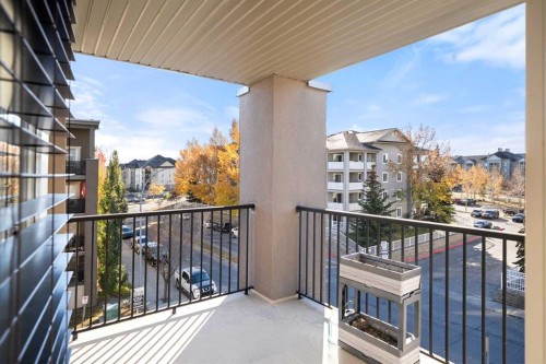3309-403 Mackenzie Way Sw, Airdrie, AB - Outdoor With Balcony With Exterior