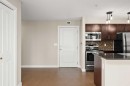 3309-403 Mackenzie Way Sw, Airdrie, AB  - Indoor Photo Showing Kitchen With Stainless Steel Kitchen 