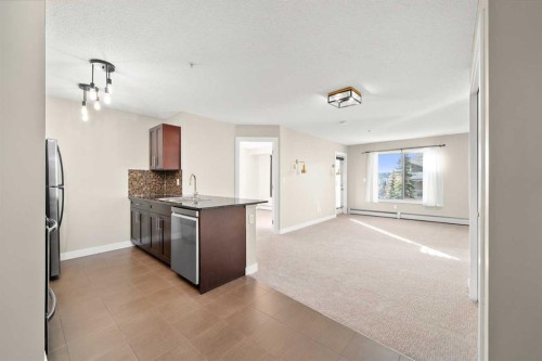 3309-403 Mackenzie Way Sw, Airdrie, AB - Indoor Photo Showing Kitchen With Stainless Steel Kitchen