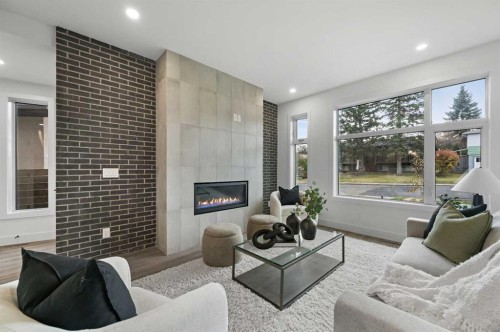 7722 47 Avenue Nw, Calgary, AB - Indoor Photo Showing Living Room With Fireplace