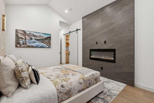1330 8 Avenue Se, Calgary, AB - Indoor Photo Showing Bedroom With Fireplace