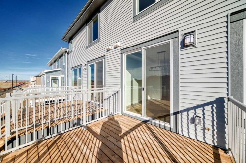 40 Southborough Common, Cochrane, AB - Outdoor With Deck Patio Veranda With Exterior