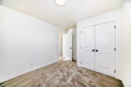 40 Southborough Common, Cochrane, AB - Indoor Photo Showing Other Room