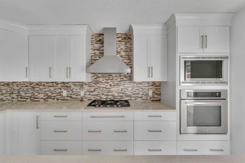 338 Panamount Drive Nw, Calgary, AB - Indoor Photo Showing Kitchen With Upgraded Kitchen