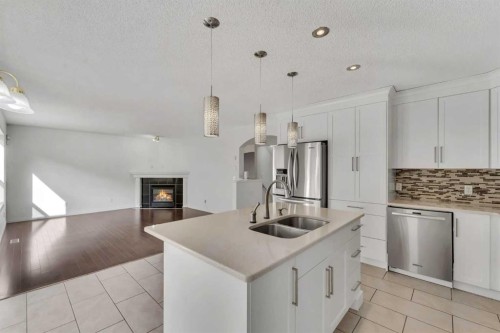 338 Panamount Drive Nw, Calgary, AB - Indoor Photo Showing Kitchen With Stainless Steel Kitchen With Double Sink With Upgraded Kitchen