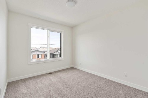 10 Herron Common Ne, Calgary, AB - Indoor Photo Showing Other Room