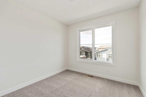 10 Herron Common Ne, Calgary, AB - Indoor Photo Showing Other Room