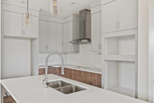 10 Herron Common Ne, Calgary, AB - Indoor Photo Showing Kitchen With Double Sink