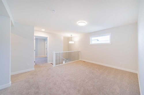 22 Herron Common Ne, Calgary, AB - Indoor Photo Showing Other Room