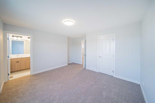 22 Herron Common Ne, Calgary, AB - Indoor Photo Showing Other Room