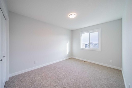 22 Herron Common Ne, Calgary, AB - Indoor Photo Showing Other Room