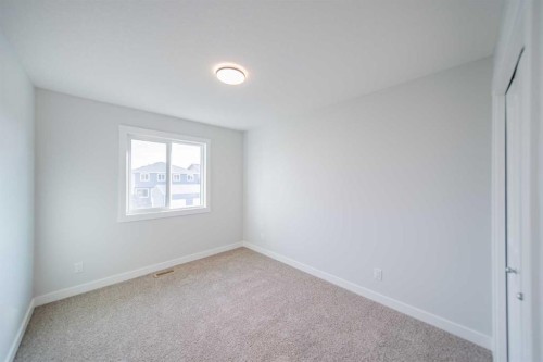 22 Herron Common Ne, Calgary, AB - Indoor Photo Showing Other Room