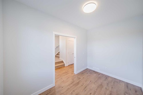 22 Herron Common Ne, Calgary, AB - Indoor Photo Showing Other Room