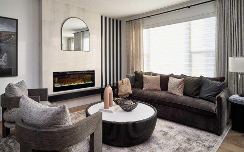 192 Creekstone Circle Sw, Calgary, AB - Indoor Photo Showing Living Room With Fireplace