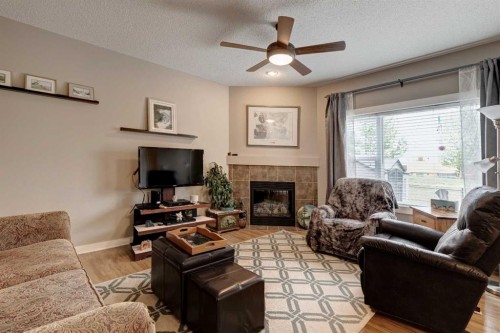 267 Silverado Plains Close Sw, Calgary, AB - Indoor Photo Showing Living Room With Fireplace