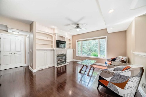 29 Simcoe Gate Sw, Calgary, AB - Indoor Photo Showing Other Room With Fireplace