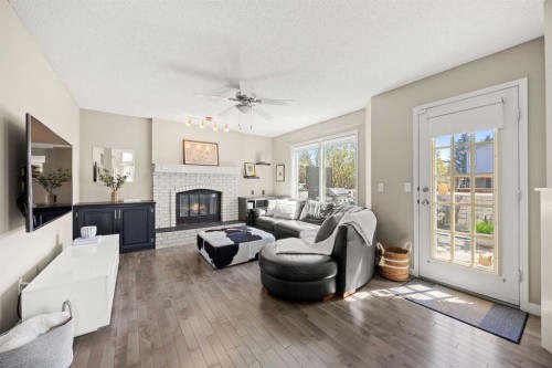 34 Sunhaven Link Se, Calgary, AB - Indoor Photo Showing Living Room With Fireplace