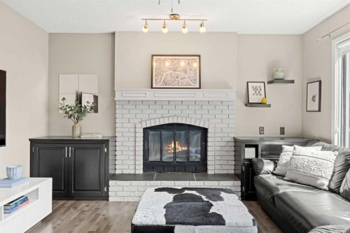 34 Sunhaven Link Se, Calgary, AB - Indoor Photo Showing Living Room With Fireplace