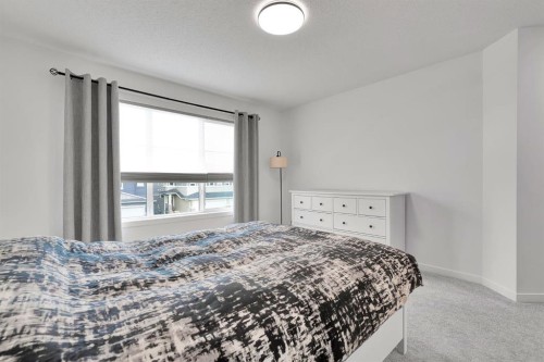 179 Willow Place, Cochrane, AB - Indoor Photo Showing Bedroom