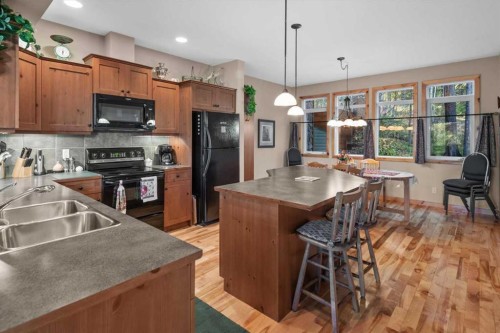 1073 Wilson Way, Canmore, AB - Indoor Photo Showing Kitchen With Double Sink