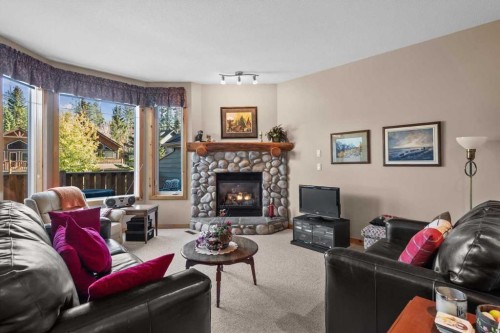 1073 Wilson Way, Canmore, AB - Indoor Photo Showing Living Room With Fireplace