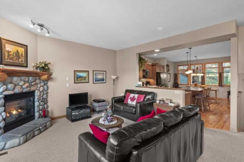 1073 Wilson Way, Canmore, AB - Indoor Photo Showing Living Room With Fireplace