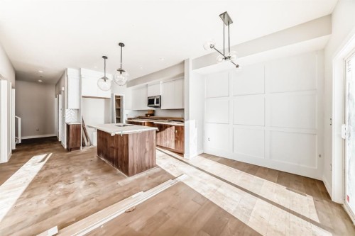 512 Heritage Boulevard, Cochrane, AB - Indoor Photo Showing Kitchen