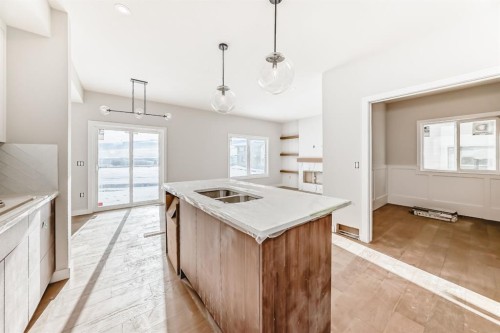 512 Heritage Boulevard, Cochrane, AB - Indoor Photo Showing Kitchen With Double Sink