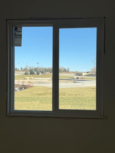 524 Heritage Boulevard, Cochrane, AB - Indoor Photo Showing Other Room