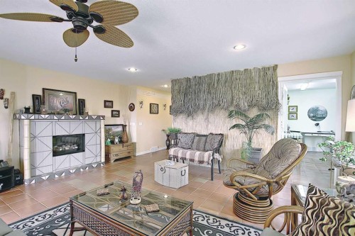 255046 Township Road 250, Rural Wheatland County, AB - Indoor Photo Showing Living Room With Fireplace