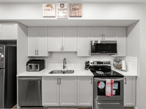 410 Copperstone Manor Se, Calgary, AB - Indoor Photo Showing Kitchen With Stainless Steel Kitchen With Double Sink