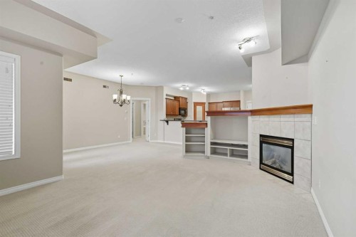 240-30 Sierra Morena Landing Sw, Calgary, AB - Indoor With Fireplace