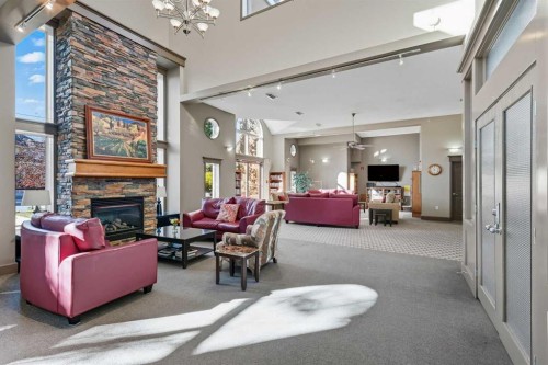 240-30 Sierra Morena Landing Sw, Calgary, AB - Indoor With Fireplace