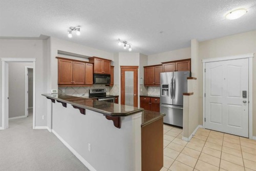 240-30 Sierra Morena Landing Sw, Calgary, AB - Indoor Photo Showing Kitchen With Double Sink