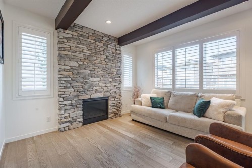 55 Legacy Woods Bay Se, Calgary, AB - Indoor Photo Showing Living Room With Fireplace