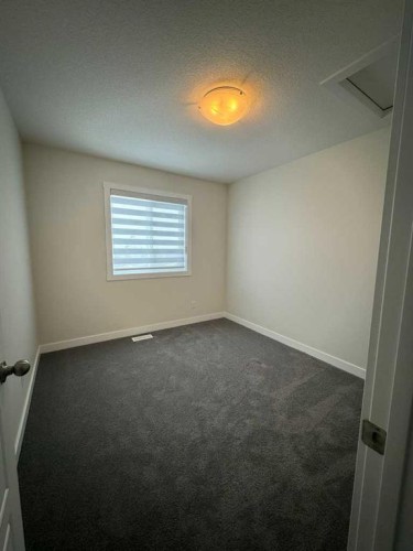 150 Edith Green Nw, Calgary, AB - Indoor Photo Showing Other Room