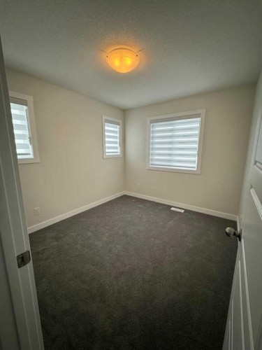150 Edith Green Nw, Calgary, AB - Indoor Photo Showing Other Room