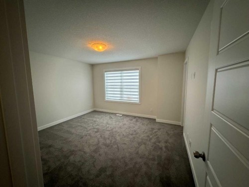 150 Edith Green Nw, Calgary, AB - Indoor Photo Showing Other Room