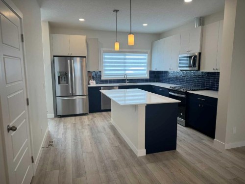 150 Edith Green Nw, Calgary, AB - Indoor Photo Showing Kitchen With Stainless Steel Kitchen With Upgraded Kitchen